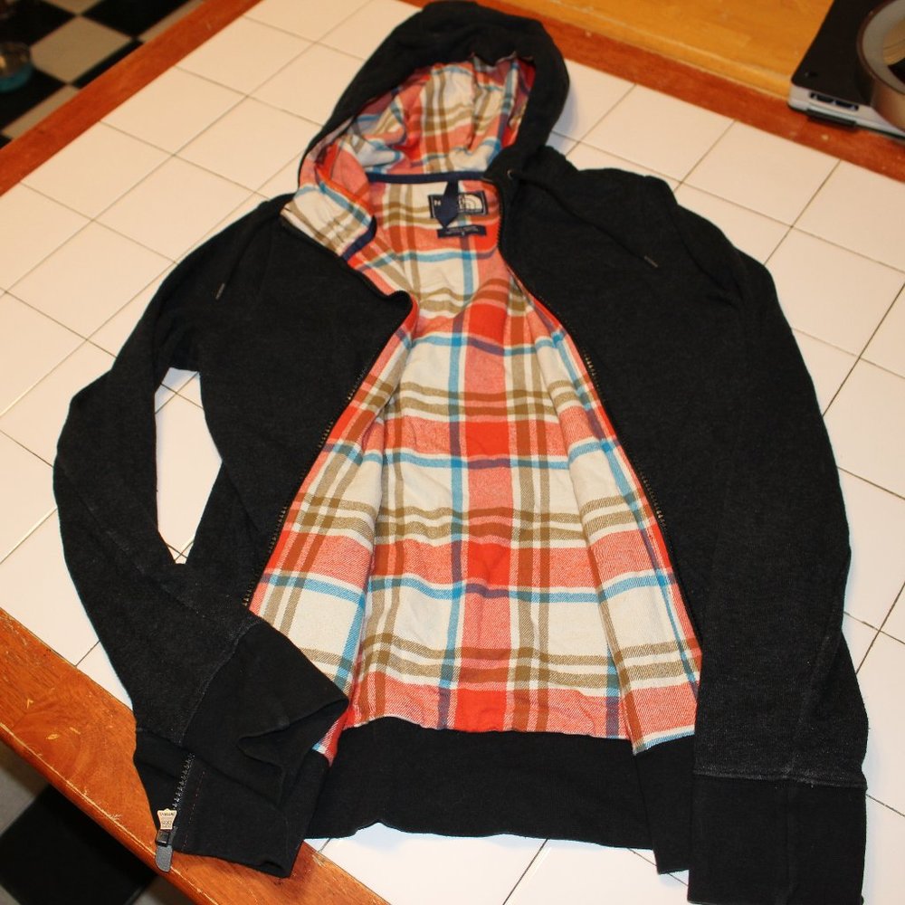 The North Face Black Hoodie with Reddish Orange/Blue Plaid Lining